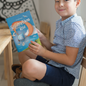 book-mockup-of-a-little-boy-reading-and-smiling
